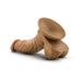 Tan realistic dildo with suction cup base and detailed texture, including sculpted veins and balls.