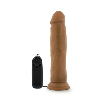 Realistic brown vibrating dildo with suction cup base and black wired remote control on white background.