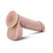 Beige realistic dildo with suction cup base and textured shaft for hands-free use and harness compatibility.