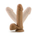 Tan realistic dildo with suction cup base and textured details shown in multiple angled positions on white background.