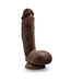 Chocolate-colored realistic dildo with balls and suction cup base standing upright on white background.