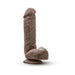 Realistic 8.5 inch chocolate-colored dildo with textured veins and suction cup base for hands-free use.