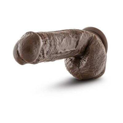 Realistic chocolate-colored 8.5 inch dildo with textured veins and suction cup base for hands-free use.