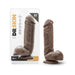 Chocolate-colored realistic dildo with suction cup base, displayed next to its clear packaging labeled Dr. Skin Mr. D 8.5 inch.