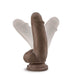 7-inch realistic brown poseable dildo with balls and suction cup base shown in adjustable positions