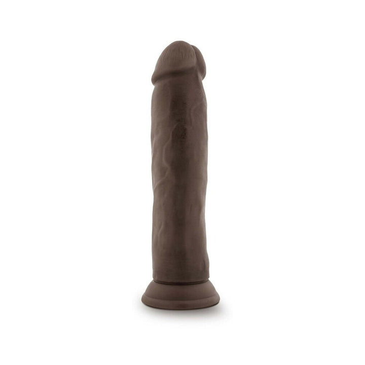 Posable 9-inch chocolate-colored dildo with realistic texture and suction cup base standing upright on white background.