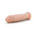 Vanilla-colored posable dildo with realistic texture and suction cup base on white background.