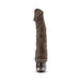 Chocolate-colored realistic textured vibrating dildo with twist dial control base on white background.