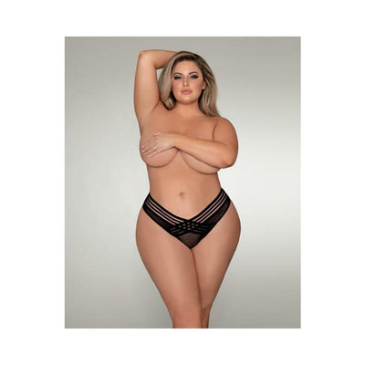 Plus size model wearing black mesh thong with shadow stripe elastic front detail against neutral background