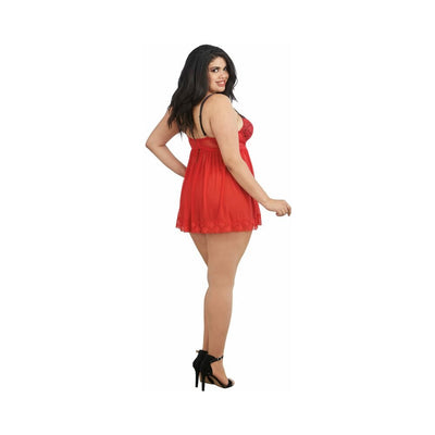 Plus size model wearing red mesh lace babydoll lingerie with black adjustable straps and black high heel sandals, side pose.