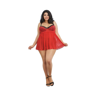 Plus size model wearing a red mesh lace babydoll with black straps and matching lingerie, paired with black heels.