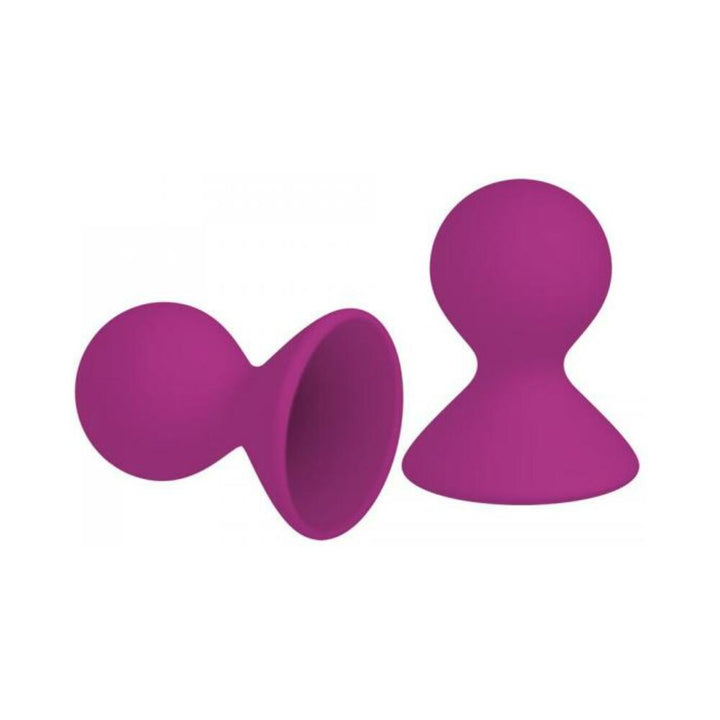 Pair of bright pink silicone nipple suckers with bulbous tips and wide bases for secure suction.