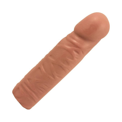 Beige strapless 7-inch textured penis extension with realistic shape and smooth tip on white background.