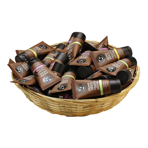 Basket filled with assorted 1 oz tubes of Hemp Seed body lotion in brown packaging with black caps.