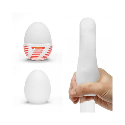 Tenga Egg Tube disposable stroker with stretchable sleeve shown in closed and open views, including hand demonstrating flexibility.