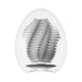 White Tenga Egg Tube with textured internal sleeve for varied sensations and stretchable fit.