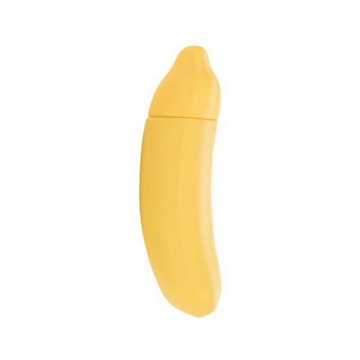 Compact yellow silicone vibrator shaped like a banana with a smooth, curved design and removable cap.