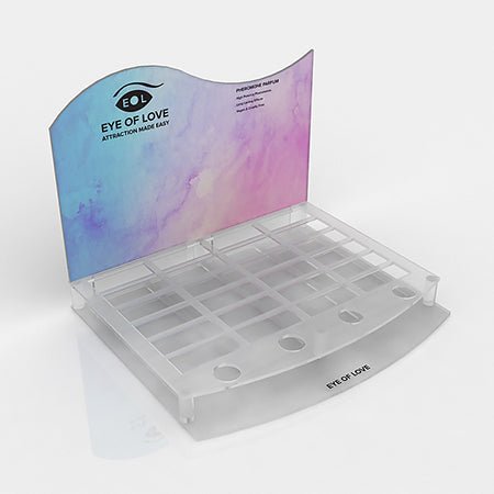 Clear acrylic counter display with pastel blue and purple backdrop for showcasing Eye of Love 10ml fragrance bottles.