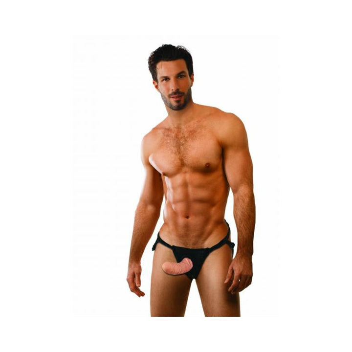 Fit male model wearing the Everlaster Wishbone Strap On harness with a 6.5-inch hollow dildo in black adjustable straps.