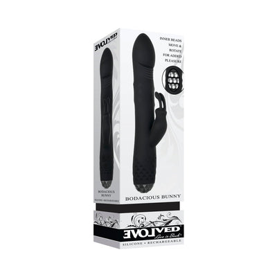 Black rotating rabbit vibrator with dual motors and textured control base shown in product packaging box.