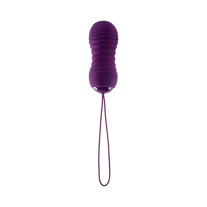Purple textured vibrating and thrusting egg with long retrieval cord against white background.