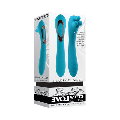 Teal rechargeable silicone vibrator with dual ends, including a textured shaft and rotating three-finger head, shown in packaging.