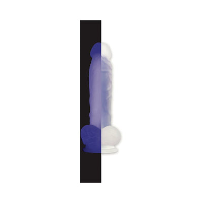 Purple realistic dildo with suction base shown glowing in the dark and in normal light side by side.