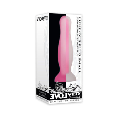 Pink small luminous silicone butt plug with suction base in white and black branded packaging.