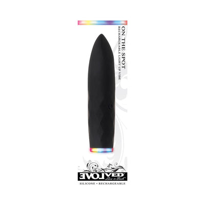 Black rechargeable silicone bullet vibrator with tapered tip and light-up base, designed for versatile use and easy charging.