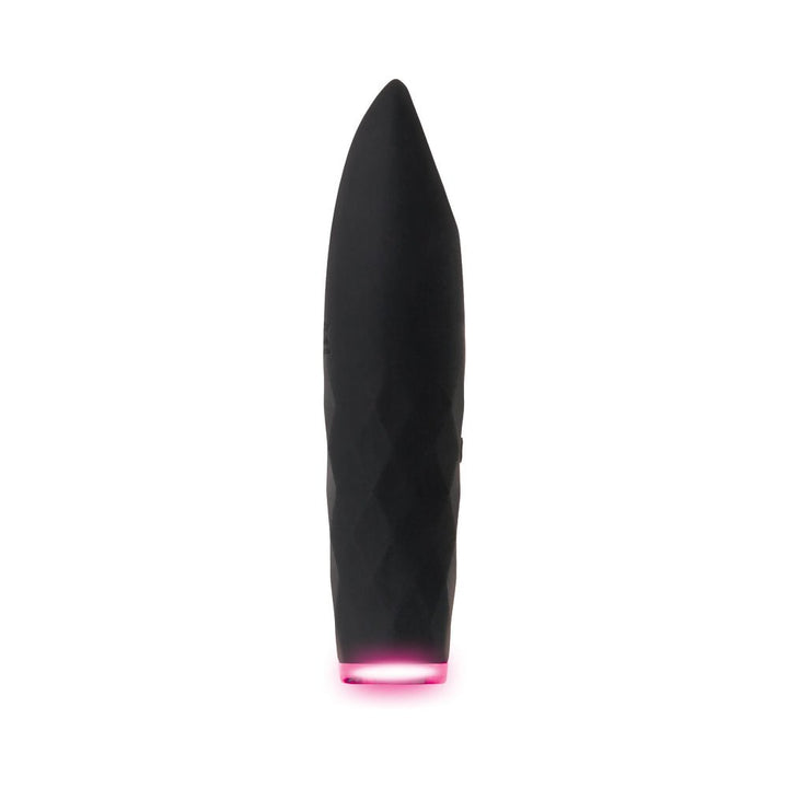 Black rechargeable silicone bullet vibrator with tapered tip and glowing pink light base on white background.