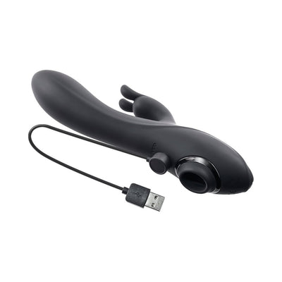 Black triple stimulator vibrator with curved shaft, rabbit attachment, suction cup, and USB charging cable on white background.
