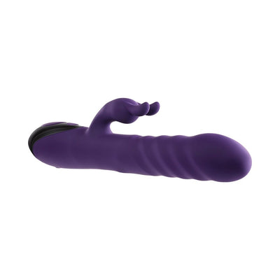 Purple silicone rabbit vibrator with textured shaft and dual motors, featuring a curved clitoral stimulator and ergonomic control buttons.