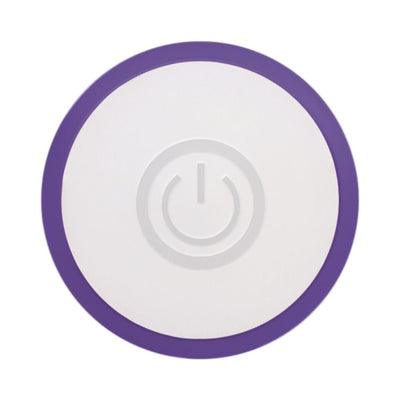 Top view of a round white and purple power button with a circular design detail in the center.