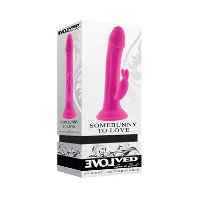Pink silicone vibrating rabbit with suction cup base shown on product packaging box.
