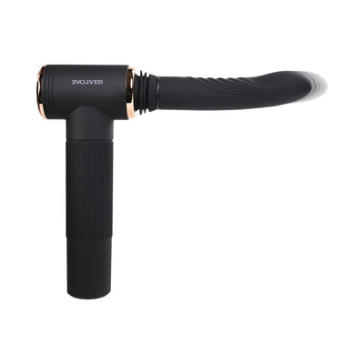Black Evolved Too Hot to Handle Thrusting Machine with sleek silicone shaft and ergonomic handle shown in motion.