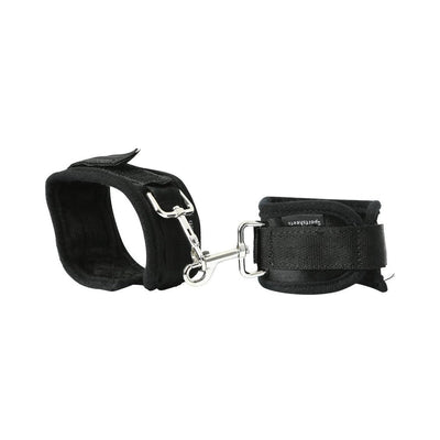 Black padded adjustable cuffs connected by a silver metal clip for use with an expandable spreader bar.