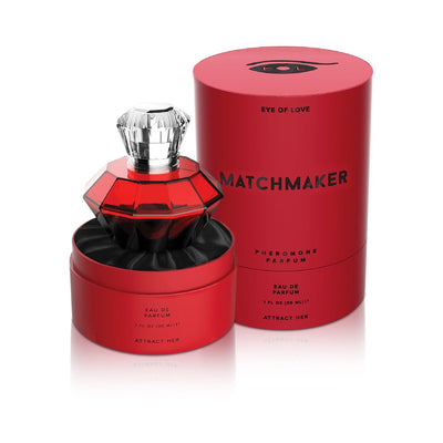 Red diamond-shaped perfume bottle with clear cap in red round box labeled Matchmaker pheromone parfum Attract Her 30ml