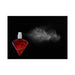 Red diamond-shaped perfume bottle spraying fine mist on black background