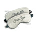 Gray satin blindfolds with reversible embroidered messages in elegant script, one side says "F-ck Me" and the other "F-ck You"
