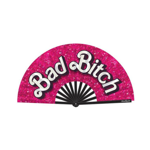 Pink folding hand fan with black ribs and bold white "Bad Bitch" text on a glittery background.