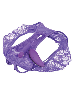 Purple lace crotchless panty with built-in bullet vibrator and wireless remote control on white background.