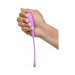 Hand holding a slim, purple silicone kegel training device with a tapered tip and flexible tail.