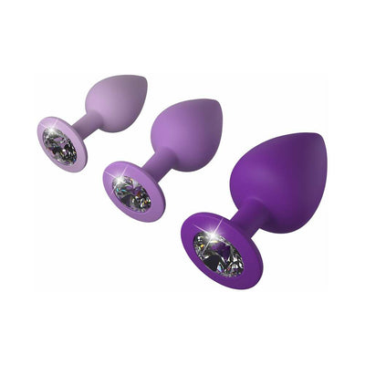 Set of three purple silicone trainer plugs with sparkling jewel bases in small, medium, and large sizes.