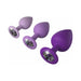 Set of three purple silicone trainer plugs with sparkling jewel bases in small, medium, and large sizes.