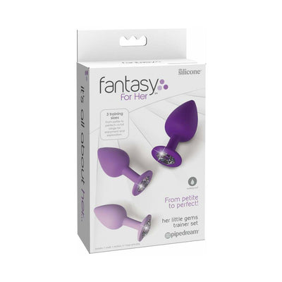 Boxed set of three purple silicone trainer plugs with sparkling jewel bases in small, medium, and large sizes.
