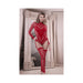 Model wearing red sheer open back long sleeve teddy bodystocking with gartered thigh-high stockings in a stylish room setting.
