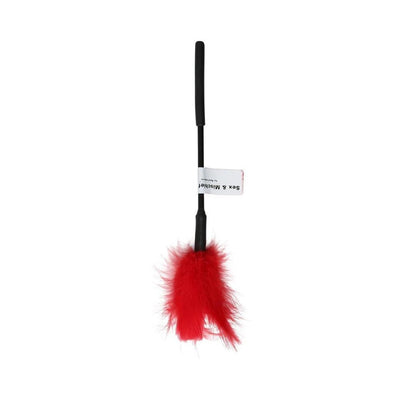Red feather tickler with black handle and soft fluffy feathers for gentle sensory play.
