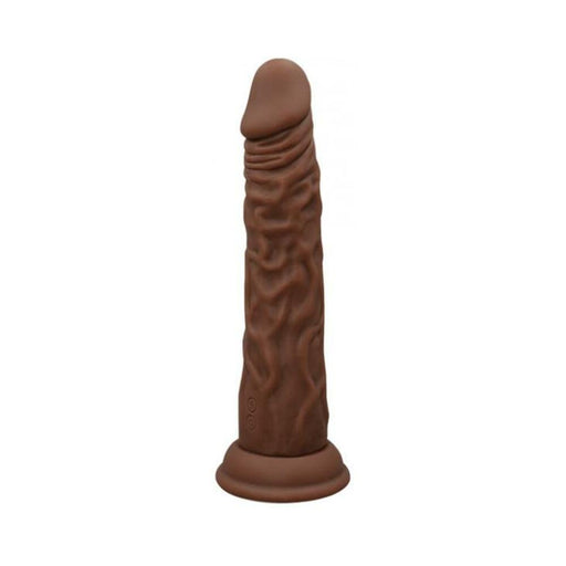 Brown wireless Turbo Shaft vibrator with realistic texture and suction base, designed for versatile and discreet pleasure.