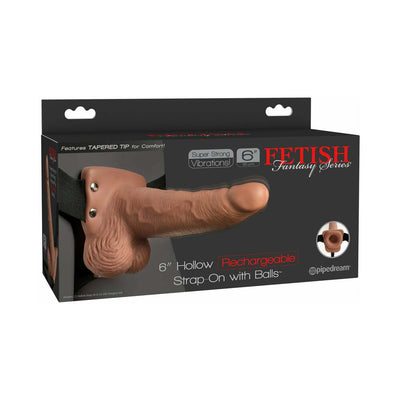 Packaging box of Fetish Fantasy 6-inch hollow rechargeable tan strap-on with balls and adjustable black harness.