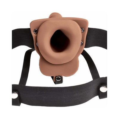 Tan 6-inch hollow strap-on with adjustable black elastic harness and secure metal fasteners.